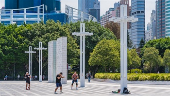 The open paved areas of the promenade attract many people as avenue for informal physical training.